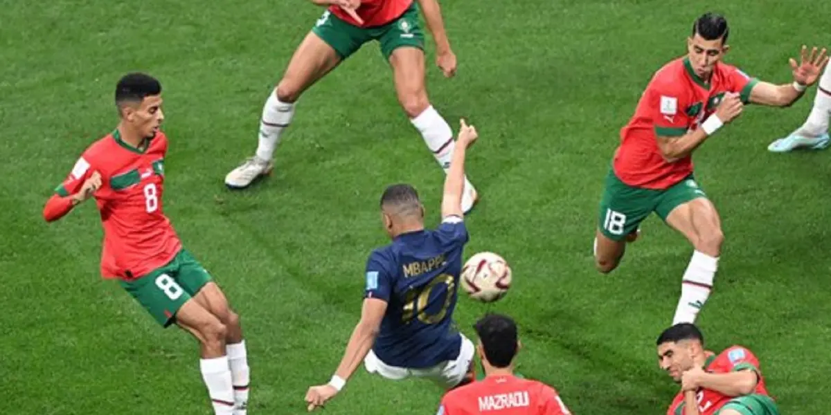 A Moroccan player is stepping over Mbappé in France's World Cup clash with Morocco